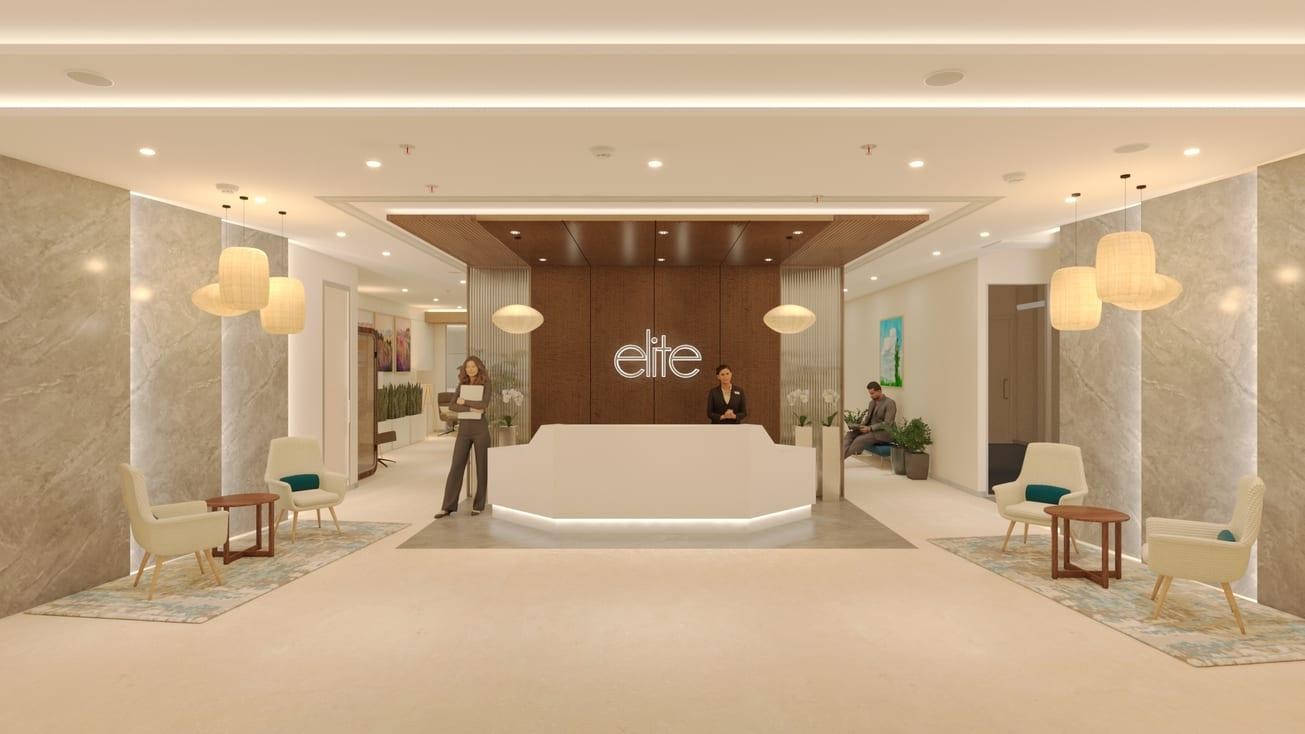 Elite by Awfis reception with a stone concierge desk and warm timber finishes